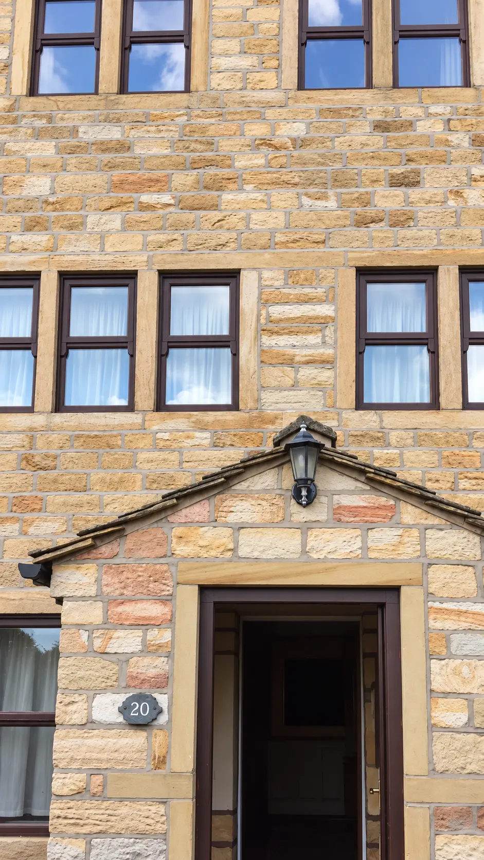 Professionally cleaned natural stone house frontage