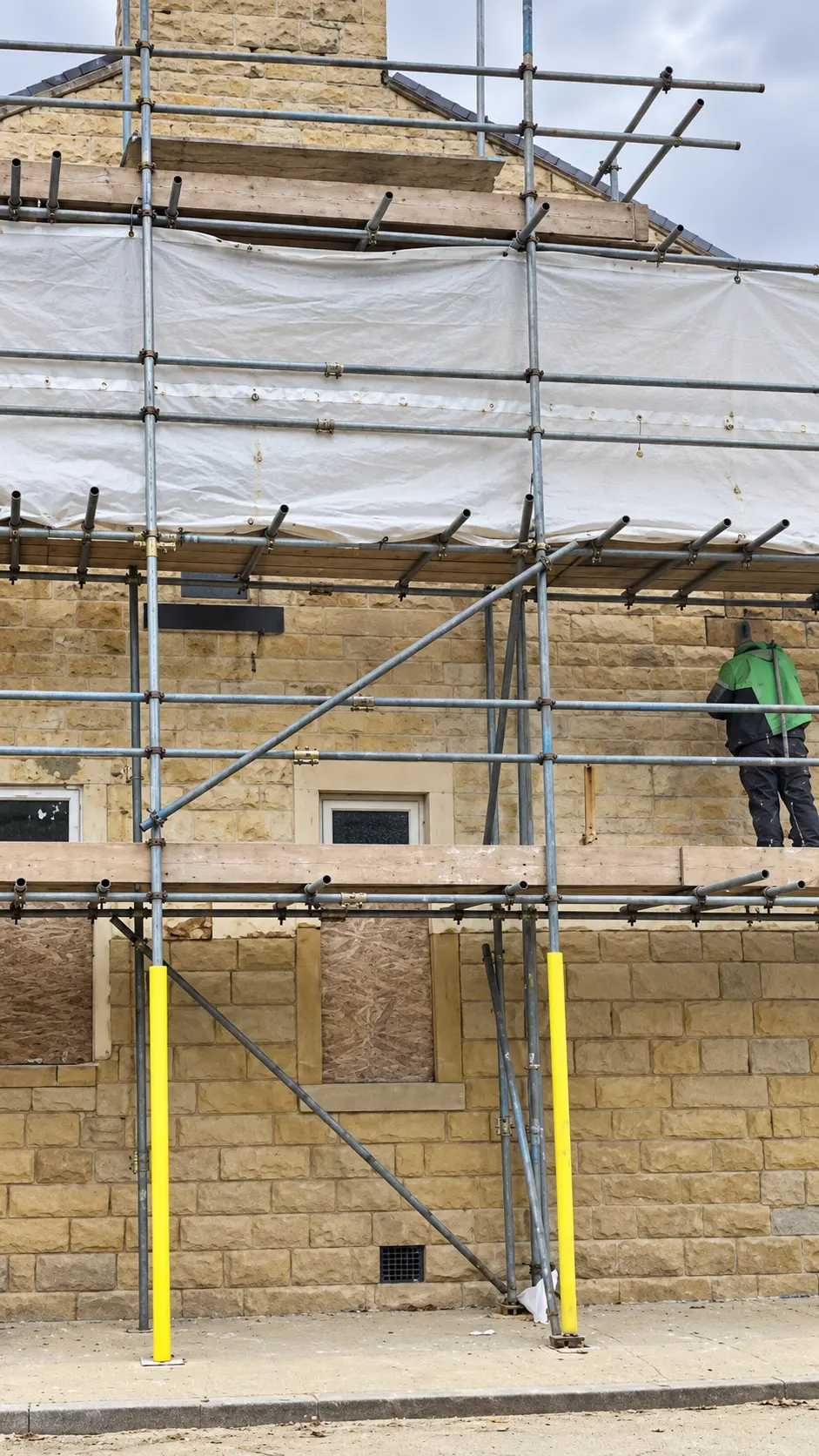 Large exterior stone cleaning project using scaffolding